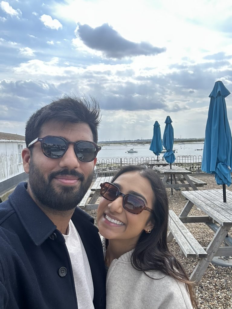 Aman and Ashmeet taking a selfie by the water